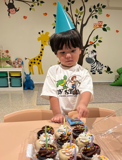 Child enjoying a birthday celebration at Mundo Feliz Daycare